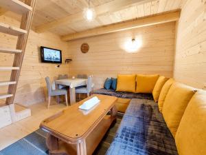 a living room with a couch and a table at Dušan_guest_house in Kolašin