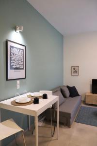 a living room with a couch and a table at Aelia Apartment 2 Ioannina in Ioannina