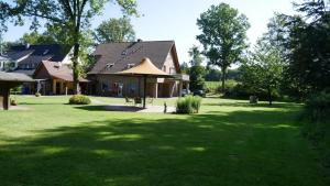 a house with a large yard with a large at FeWo Lienen in Lienen