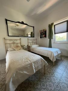 Postel nebo postele na pokoji v ubytování Casa di Nonna, Holiday Villa Apartment