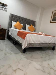 Hotel Orquídea Real客房内的一张或多张床位