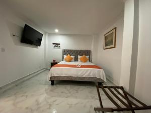 Hotel Orquídea Real客房内的一张或多张床位