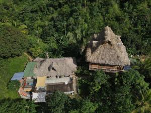 an overhead view of a house with a grass roof at Frana Lodge in El Zaino