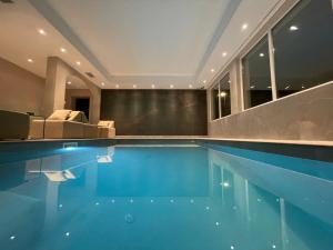 a swimming pool in a hotel room with at Boutique Hotel Acacia in Lovran
