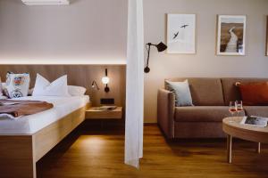 Letto o letti in una camera di Achs-Wendelin Weinlofts
