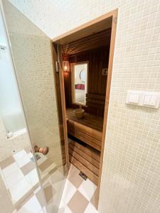 a bathroom with a sink and a mirror in a room at Studio at Synagogue with Sauna in Budapest