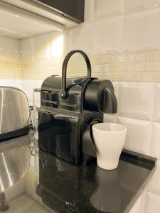 a black bag sitting on a counter in a kitchen at Studio at Synagogue with Sauna in Budapest