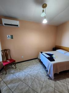 En eller flere senge i et værelse på Pousada Pedra das Tartarugas