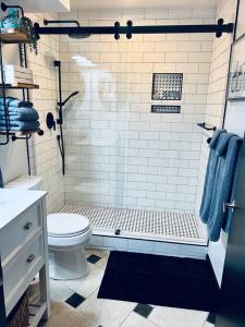 a bathroom with a shower and a toilet at Upscale Mission Beach Couples Getaway/Pet Friendly in San Diego