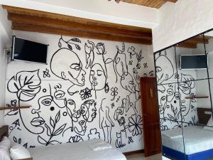 Postel nebo postele na pokoji v ubytování Hotel Karukera