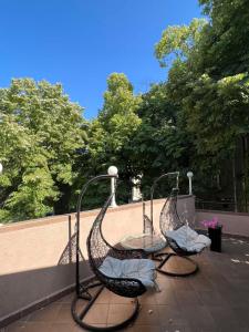 two wrought iron chairs sitting on a patio at Escape Shumen in Shumen