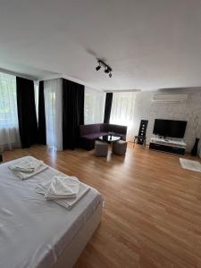 a bedroom with a bed and a living room at Escape Shumen in Shumen