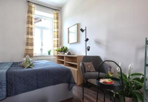 Postel nebo postele na pokoji v ubytování Apartmány U Aloise