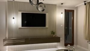 A television and/or entertainment centre at Luxury Martina apartment Még 27 kép