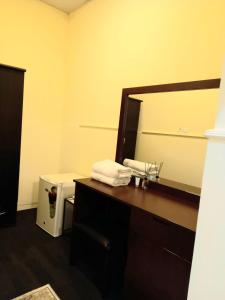 a bathroom with a sink and a mirror at Holiday Homes in Ras al Khaimah