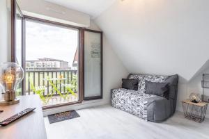 Posedenie v ubytovaní Cabourg Au P'tit Nid, cocon au bord de mer