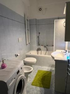 a bathroom with a sink and a toilet and a tub at A casa di Rita bilocale in Sanremo in Sanremo