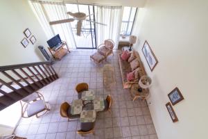 a living room with a couch and a table at Takanoha Condo in Kahuku