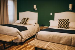 Ένα ή περισσότερα κρεβάτια σε δωμάτιο στο Anden Inca Hotel