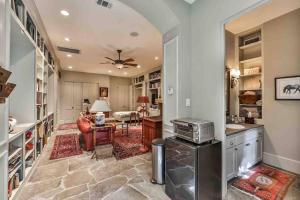 a kitchen with a living room and a dining room at Artist's Library with a Private Swimming Pool in Houston
