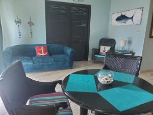 a living room with a table and a couch at FunSea Water View Apt in Culebra
