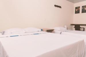 Letto o letti in una camera di Vivienda turística Arboleda de Cádiz