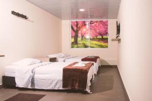 Letto o letti in una camera di Vivienda turística Arboleda de Cádiz