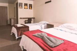 Letto o letti in una camera di Vivienda turística Arboleda de Cádiz