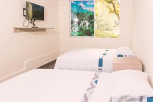 Letto o letti in una camera di Vivienda turística Arboleda de Cádiz