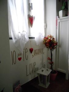 a room with a window with hearts on the wall at La casa azzurra in Moneglia