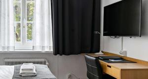 TV a/nebo společenská místnost v ubytování Best Western Hotel Anno 1937