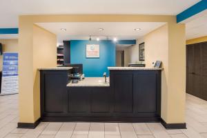 a waiting area at a hospital with a blue wall at SureStay Plus Hotel by Best Western Jasper in Jasper