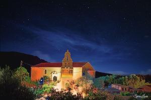 a church at night with a starry sky at Auntie Katie's house in Giannádes