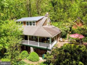 an aerial view of a house in the woods at Lock Keepers Cottage on C&O Canal/Potomac River in Sharpsburg