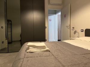 a bedroom with a bed with a towel on it at Casa Vacanze Alle Campore in Terni