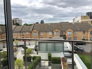 a view of a building from a balcony at STUDIO Apartment opposite shoreditch Park in London