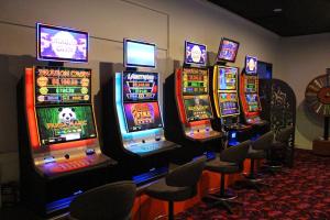 a bunch of slot machines lined up in a room at Warrego Hotel Motel Cunnamulla in Cunnamulla