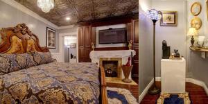 um quarto com uma cama e uma lareira com uma televisão em McMillan Inn em Savannah