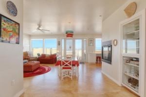 a living room with a table and a dining room at 1460 Strand Way in Oceano