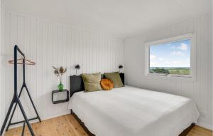 Ένα ή περισσότερα κρεβάτια σε δωμάτιο στο Three-Bedroom Holiday Home In Vig