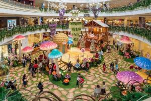 an overhead view of a shopping mall with umbrellas at 3Storey House 13Pax Family Suite in Bayan Lepas