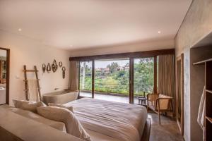 Hidden Gem Suites Ubud客房内的一张或多张床位