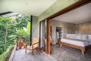Hidden Gem Suites Ubud客房内的一张或多张床位