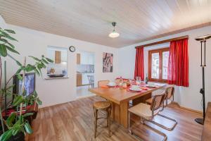 a dining room with a wooden table and chairs at Casa Traversi - Happy Rentals in Cevio