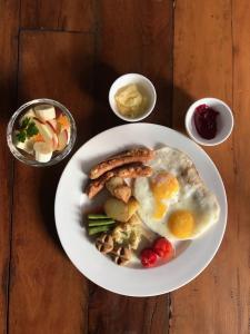 a plate of breakfast food with eggs and toast at Yalamul Garden in Pātan