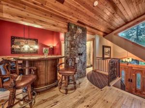 a large room with a bar in a cabin at Tahoe Alpine Lodge in South Lake Tahoe