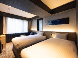 Postel nebo postele na pokoji v ubytování La'gent Hotel Kyoto Nijo