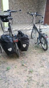 two bikes parked next to each other with bags on them at Kalamana Serene in Chāvakkād