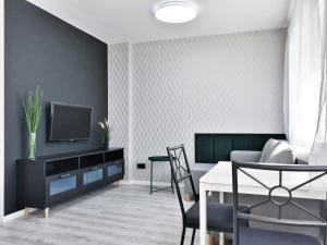 a living room with a couch and a tv and a table at Wera in Kłodzko