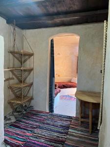 a room with a bed and a room with a rug at Grand Siwa in Siwa